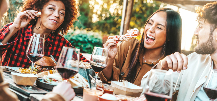 a group of friends eating at a restaurant